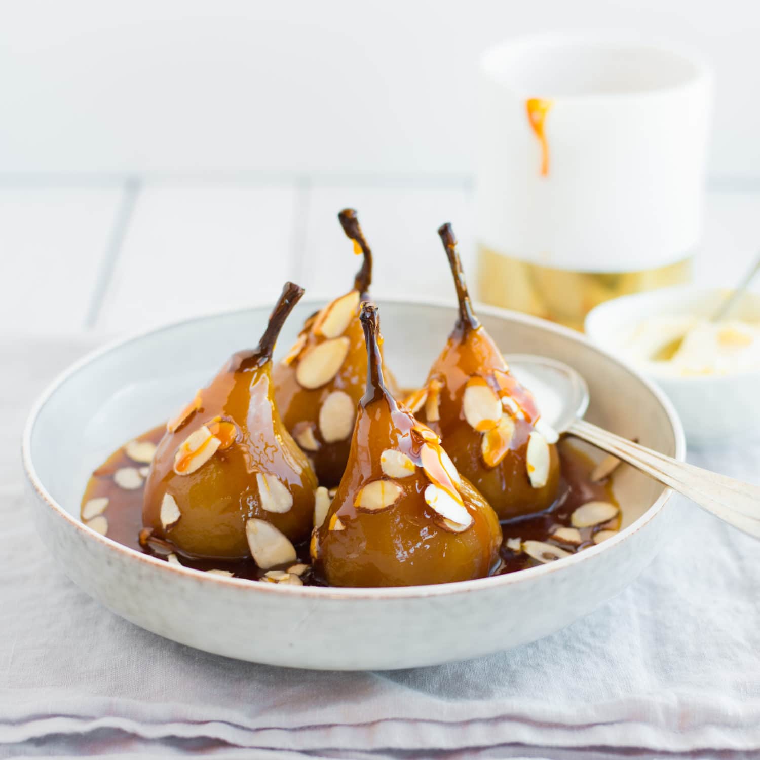 Salted caramel poached pears with yoghurt and almonds - Nadia Lim